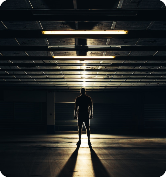 A guy standing in the dark